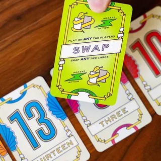 In Flip 7: With a Vengeance, the Swap card lets you swap any two face up cards on the table.

Would you use it to Bust an opponent? Or steal a high value card for yourself??

#boardgames #flip7 #flip7
