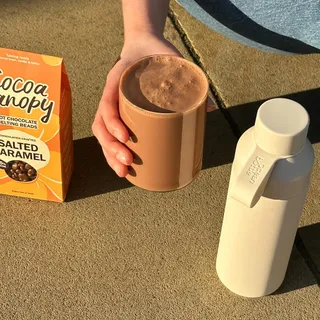 Cocoa Canopy x Ocean Bottle - bringing real hot chocolate to summer days. Cheers to BST, slow moments & garden parties.

How to | Shaken Iced Chocolate
Step 1: add 4-5 tsp Hot Chocolate Melting Beads 