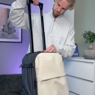 Simply avoid extra luggage fees with this personal item sized backpack-trolley.