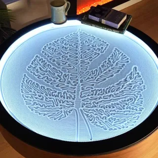 The Oasis Coffee Table sculpts a graceful leaf, bringing botanical elegance to your living space.