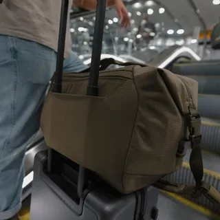 Step 1: You tell us how you like to carry your gear. 

Step 2: Transit Duffel 25L

Now with a luggage pass through and end handles, in addition to an improved shoulder strap and sturdy, built-in top h