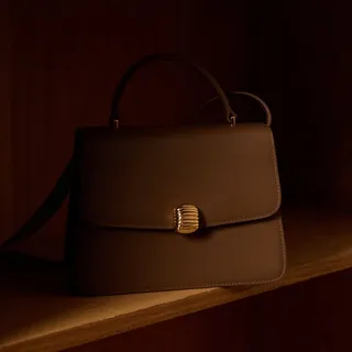 Set against warm wood tones, Nebula 21 in Cedar reveals its quiet depth. Smooth nappa leather, sculpted metal, and a silhouette that settles effortlessly into its surroundings.

Shop now on WWW.MOONSH